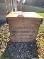 Front view of antique wooden box showing Bruce Produce Co. stenciled label.