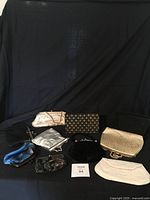 Overview of 12 vintage purses including metallic, beaded, fabric designs set against a black background