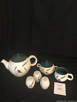 Photo showing entire Denby Greenwheat pottery set including teapot, sugar bowl with lid, creamer, and four shakers.