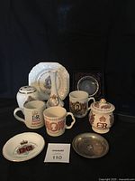 Full set of Elizabeth II Silver Jubilee commemorative items on black background