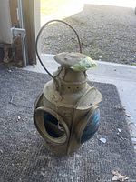 Full side and top view showing the handle, body, and one cracked glass lens missing one light cap