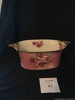 Front view of the Royal Staffordshire terrine showing floral design and gold handle accents