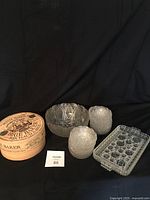 Overview of all vintage and new kitchenware items including large bowl, mini bowls, snack trays, and brie baker box