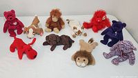 Overview photo showing all 10 assorted Beanie Baby plush toys on a white surface.