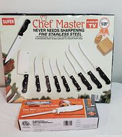 Chef Master 10-piece knife and cleaver set box showing various knives and cleaver with black handles and stainless steel blades, one piece missing from the set