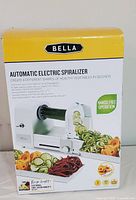 Front side of box showing product image, brand, and product name with uses of the spiralizer shown with vegetable spirals