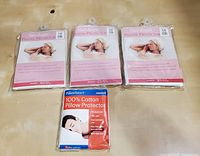 Four pillow protectors in original packaging including three Hair-Keeper satin cotton and one Pillow Savers cotton protector