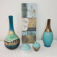 Lot of teal decor with four vases and one wall hanging canvas showing full set