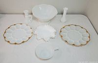 Full lot including two deviled egg plates, ruffled edge bowl, compote, small creamer, and vases