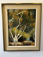 Full view of framed oil painting depicting white tree branches and autumnal forest scene.