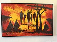 Front view of the framed oil painting showing vivid orange and yellow background with black silhouetted shapes and artist signature.