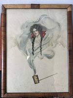 Full view of the framed lithograph depicting a woman's face in smoke rising from a pipe.