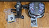 Top view of Sportneer pedal exerciser and iComfort foot massager with instruction manuals visible.