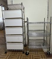Wide shot showing both metal wire shelving units next to each other on wooden floor.