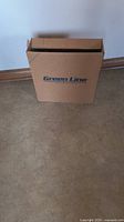 Box labeled 'Green Line' containing the hose.