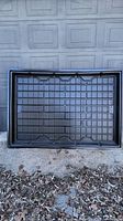 Black plastic flood table/gardening tray with rectangular shape and grid pattern seen from above, showing its size and structure.