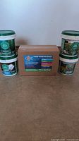 Photo showing the full kit with four Gaia Green container buckets and FOOP Starter Pack box in the center