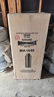 Box standing upright showing branding and product details for Mountain Air MA 1440 activated carbon filter.