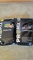 Two bags of Promix soil amendments side by side showing labeling and product images