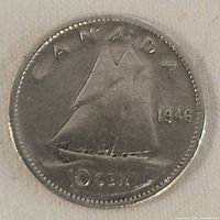 Reverse side showing sailing ship, denomination, and date 1946