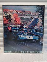 Framed vintage 1971 Grand Prix of the United States poster showing race cars on a track surrounded by fall foliage.