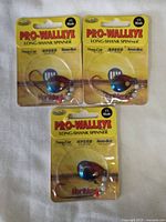 Three sealed Pro-Walleye Long-Shank Spinner fishing lures with #3 blades in original yellow packaging.