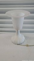 Full view of the vintage Rosenthal Germany white table lamp with flared frosted glass shade and ribbed ceramic base.