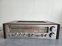 Straight-on front view showing full control panel, tuning scale and knobs