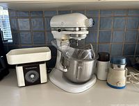 Photo showing vintage KitchenAid mixer, Williams-Sonoma kitchen scale, and two small electric grinders on countertop