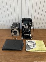 Overview of all lot items on wood surface against white wall