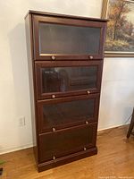 Front view of full bookcase showing four glass-front sections