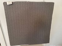 Gray side of the foam bed wedge pillow with textured fabric.