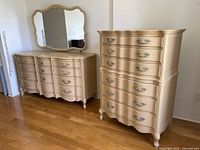 Overview of full set showing dresser with mirror and tall chest