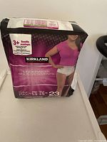 Front view of a package with 23 pieces of Kirkland Signature women's underwear size S/M, showing product benefits and sizing details