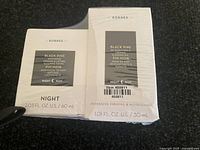 Korres Black Pine night cream and sleeping oil in original sealed packaging.