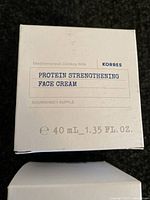 Four boxes of Korres Mediterranean Donkey Milk Protein Strengthening Face Cream, each 40 mL, stacked on a dark surface.