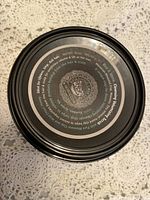 Top view of the jar lid showing the product name, Rhassoul Lava Clay, and product volume 15 oz.