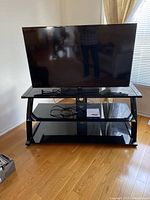 Front view of the 48" Samsung LED TV on stand