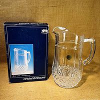 Photo of the crystal jug with original blue box featuring product image and branding.