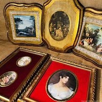 Cluster of 5 Florentine prints including two square gold-framed plaques with Rococco garden scenes, one rectangular black and white Rococco plaque, one double print with red velvet matting and gilt frame, and one gilt-framed portrait with bubble glass and red velvet matting.
