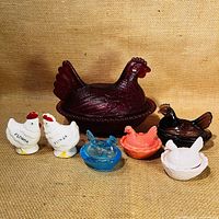 Front view of all hens on nests and salt & pepper shakers arranged on canvas background.