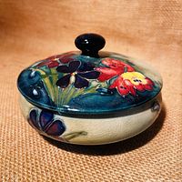 Powder bowl with lid closed showing floral relief decoration