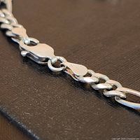 Close-up photo of the sterling silver bracelet clasp showing STG markings on both sides of the clasp confirming authentic sterling silver.