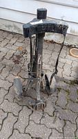 Front view of the used golf caddy cart showing frame, handle, and wheels.