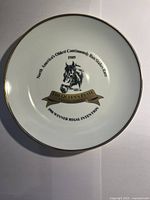 Full view of 1989 Queen's Plate commemorative plate, showing horse image, text and gold rim.
