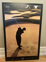 Full view of the Nike Tiger Woods plakmount showing golfer mid sand shot, framed in black composite wood mount with Nike Golf logo at bottom.