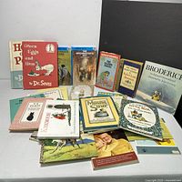 Photo showing assortment of approximately 15 children's books including two Dr. Seuss titles (Green Eggs and Ham, Hop on Pop), The Hardy Boys titles and other vintage kids books including Broderick and Little Bear series.