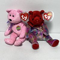 Two Ty Beanie Baby stuffed bears together showing front view with tags