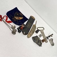 Full view of assorted vintage small antique items on white background