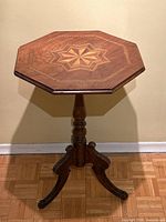 View of the full side table showing octagonal shape and pedestal base